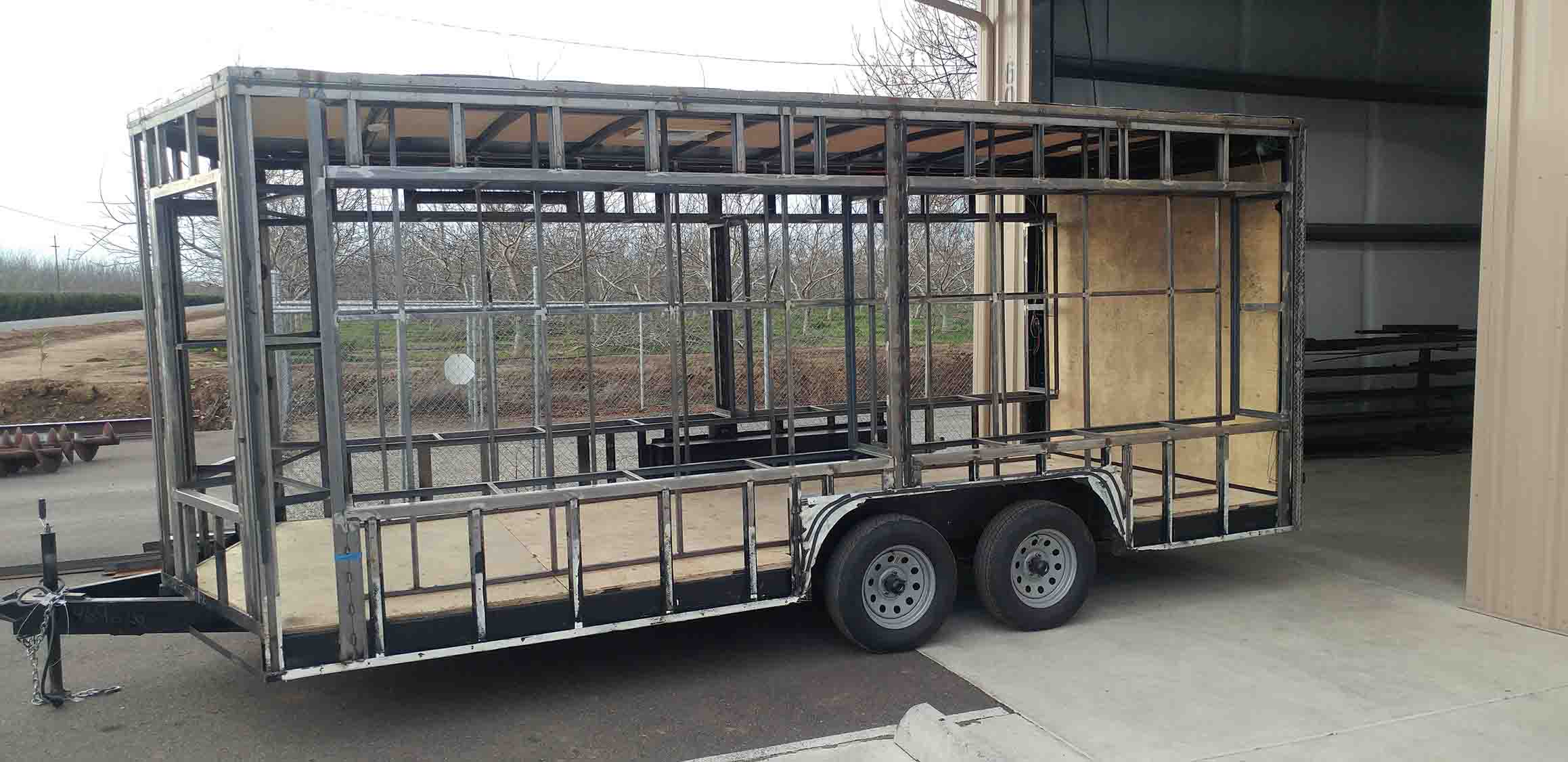 Picture of a trailer with custom built panels.