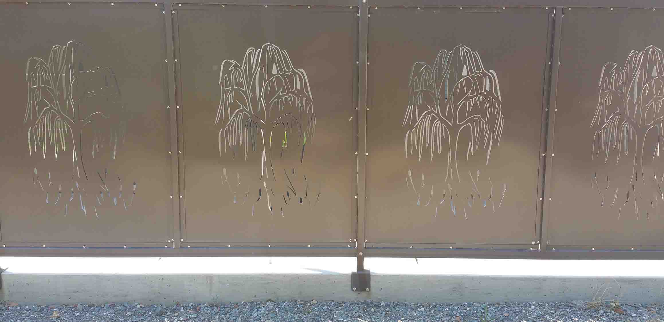 Picture of a fence privacy screen with a palm tree cutout.
